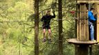 Man participating on Go Ape Treetop Challenge